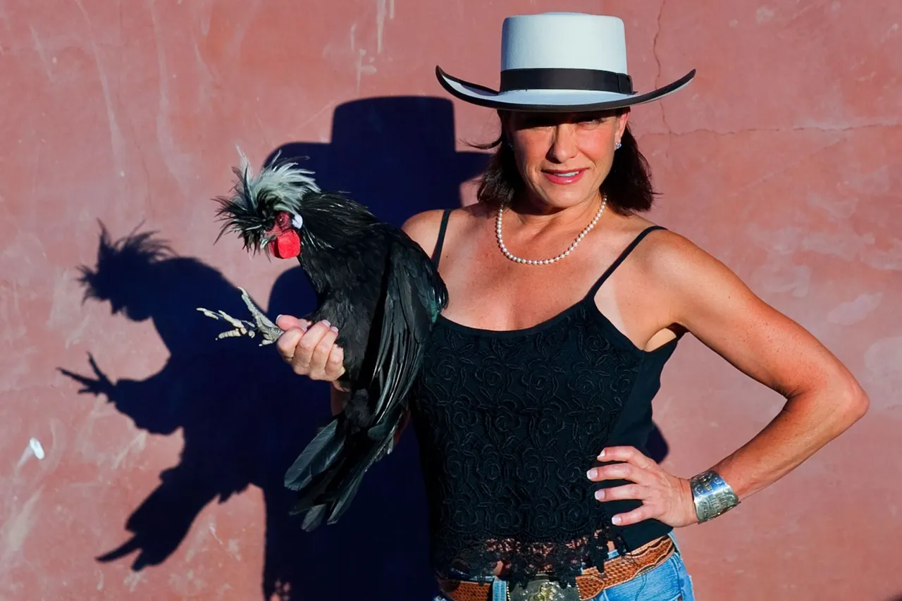 Kelly Blue with the Rooster | photograph by Ed Asmus
